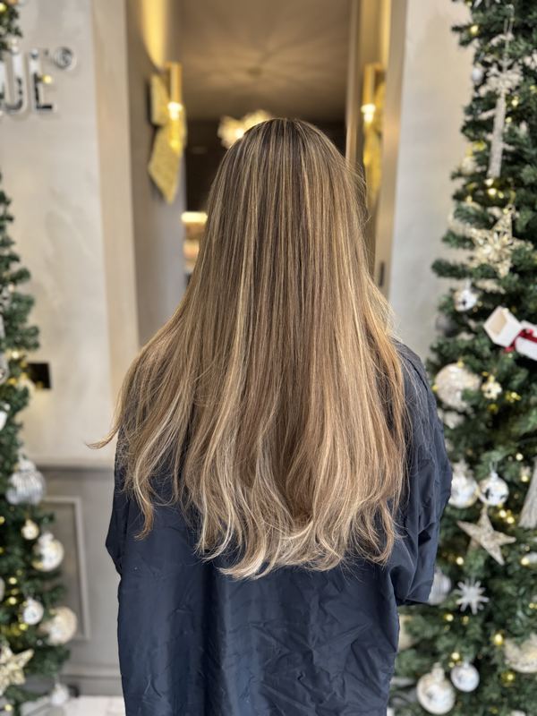 Long blonde balayage, softly polished
