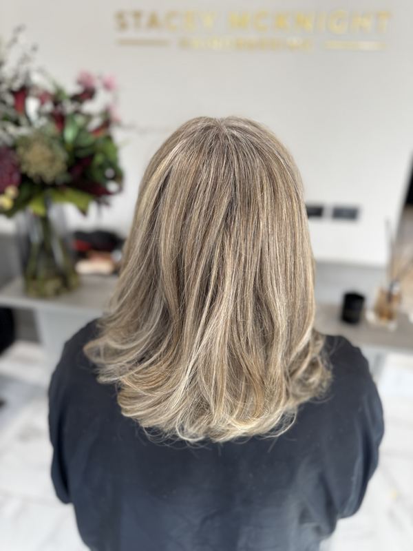 Bright blonde highlights, bouncy blow-dry
