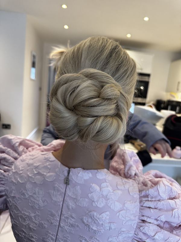 Woven chignon for a wedding guest
