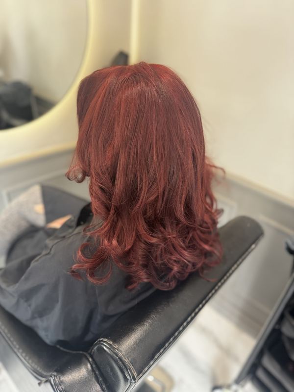 Rich cherry-red bouncy curls